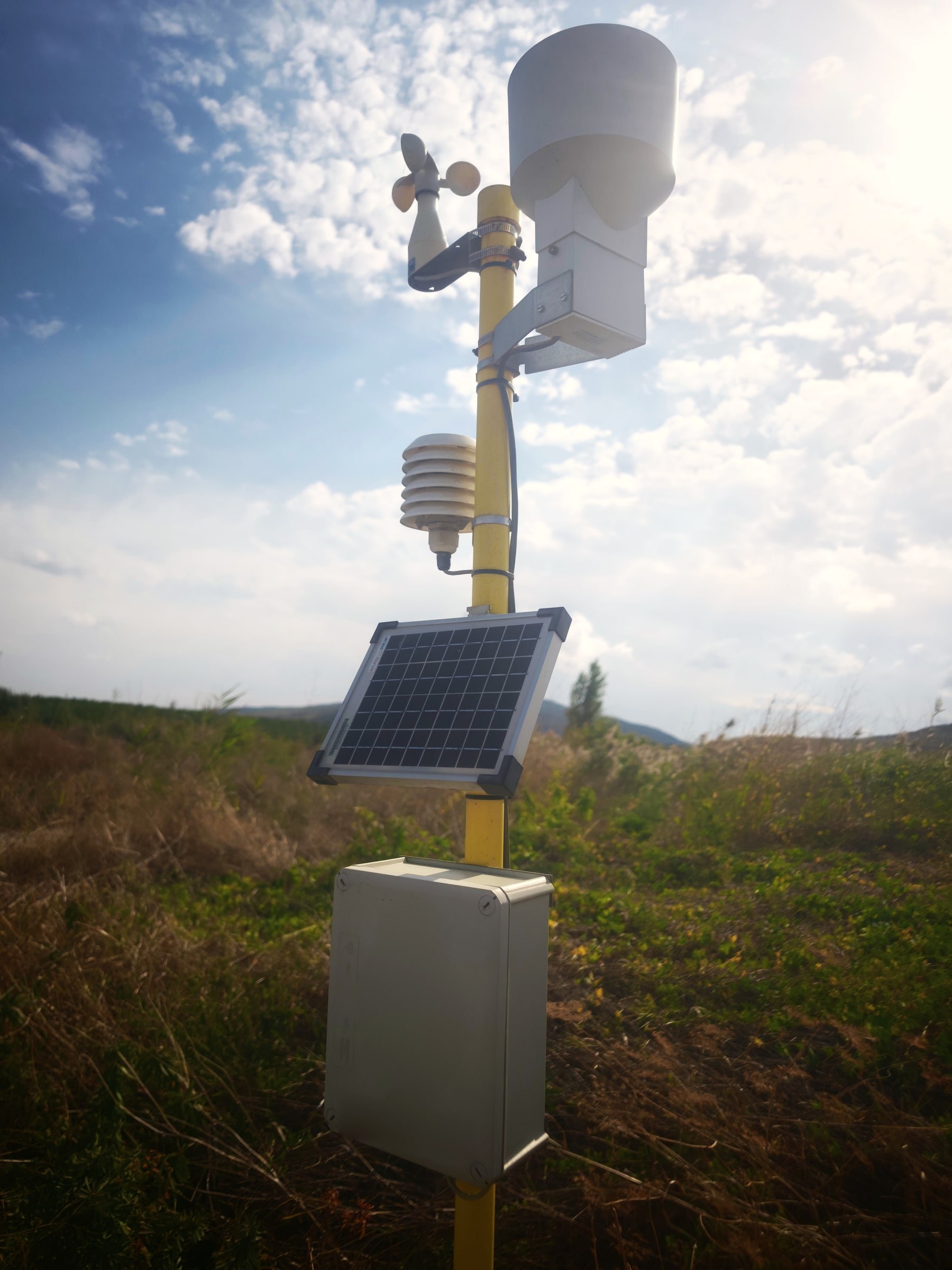 Akofruits weather station with a solar panel and sensors in the orchard
